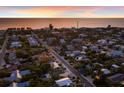 Coastal neighborhood with a beach view, highlighting many homes in a lush landscape at 313 Magnolia Ave, Anna Maria, FL 34216