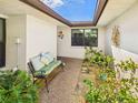 Cozy courtyard with comfortable bench seating and lush plants, perfect for relaxation at 4534 La Jolla Dr, Bradenton, FL 34210