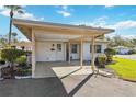 Welcoming home featuring a convenient carport, manicured landscaping, and a cozy entrance at 5020 Live Oak Cir, Bradenton, FL 34207