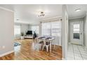 Bright living space with hardwood floors, dining area, and ample natural light at 5020 Live Oak Cir, Bradenton, FL 34207