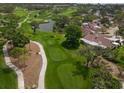 Aerial view of the home showing the property's stunning golf course community and serene pond at 5901 La Vista Ln, Bradenton, FL 34210