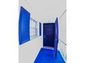 Condo entry with a blue door, blue trim and blue welcome mat at 105 47Th Avenue W Dr # 377, Bradenton, FL 34207