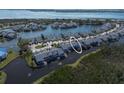 Beautiful aerial shot of waterfront townhomes with access to calm waters and lush surroundings at 1218 Spoonbill Landings Cir, Bradenton, FL 34209