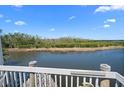 Enjoy the serene view from this patio featuring a peaceful waterfront setting at 1218 Spoonbill Landings Cir, Bradenton, FL 34209