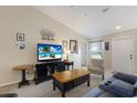 Cozy living room featuring neutral walls, comfortable seating, and stylish decor accents at 1269 Rasp Ct, North Port, FL 34288