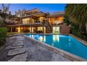 This house features a private pool, multiple balconies, and an outdoor staircase at 1364 Point Crisp Rd, Sarasota, FL 34242