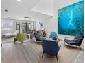 Bright living room boasts modern furniture, sleek flooring, and large windows for natural light at 1900 Harbourside Dr # 102, Longboat Key, FL 34228