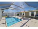 Enclosed pool area features a refreshing pool and outdoor seating, perfect for relaxing and entertaining at 2502 Larkspur Dr, Punta Gorda, FL 33950
