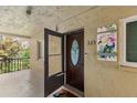 Inviting condo entrance featuring a decorative door and a welcoming, covered porch at 3664 Lake Bayshore Dr # K323, Bradenton, FL 34205