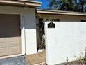 Daytime view of the home's exterior, including the address and the garage door at 3818 Sun Eagle Ln, Bradenton, FL 34210