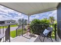 Cozy front porch with comfortable seating, perfect for relaxing and enjoying the neighborhood views at 4304 14Th E St, Ellenton, FL 34222