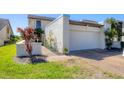 Close up of the front entrance to the garage, the unit number is visible and there are garden decorations at 4532 La Jolla Dr, Bradenton, FL 34210