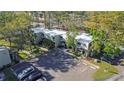 Expansive aerial view of condo community showcasing well-maintained buildings, landscaping, and ample parking at 4906 25Th W St # 106, Bradenton, FL 34207