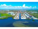 Breathtaking aerial view of waterfront homes nestled along a canal in Florida at 8219 Drew St, Englewood, FL 34224
