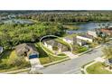 An aerial photograph of a home on a manicured corner lot with a screened in lanai and a water view at 9767 50Th Street E Cir, Parrish, FL 34219