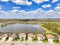 An aerial view showcasing the lakefront houses and community at 18032 Polo Trl, Bradenton, FL 34211
