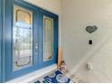 Elegant front door with glass detailing and welcoming decor at 18032 Polo Trl, Bradenton, FL 34211