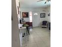 A tiled entryway featuring a wine rack and a quaint bar setup at 3013 Yarmouth W Dr, Bradenton, FL 34205