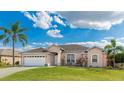 Charming single-story home with a well-manicured lawn and a two-car garage at 3106 45Th E Ave, Bradenton, FL 34203