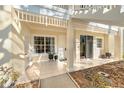 Charming condominium entrance with tile flooring, neutral tones, and beautiful architecture at 3608 54Th W Dr # 102, Bradenton, FL 34210