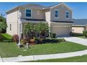 Charming two-story home with well-maintained lawn, two car garage and beautiful landscaping at 4509 Halls Mill Xing, Ellenton, FL 34222