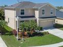 Charming two-story home with well-maintained lawn, two car garage and beautiful landscaping at 4509 Halls Mill Xing, Ellenton, FL 34222
