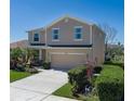Charming two-story home with well-maintained lawn, two car garage and beautiful landscaping at 4509 Halls Mill Xing, Ellenton, FL 34222