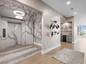 Refined condo hall featuring art and a bar area with a wine fridge and marble accents at 540 N Tamiami Trl # 1503, Sarasota, FL 34236