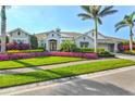 Attractive single-Gathering home boasts vibrant flower beds, well-kept lawns, and a charming facade at 556 Regatta Way, Bradenton, FL 34208