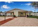 Duplex featuring matching units with covered parking and well-maintained landscaping at 5808 18Th W St # A & B, Bradenton, FL 34207