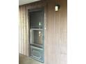 Charming front door with a screen and the house number displayed vertically to the right of the door at 6012 Oak Creek Ln # 1913, Bradenton, FL 34210