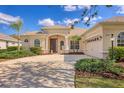 Charming single-story home featuring a two-car garage, and meticulous landscaping at 6357 Royal Tern Cir, Lakewood Ranch, FL 34202