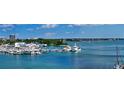 Waterfront property with marina views of boats, yachts, and other homes on the water at 688 Golden Gate Point # 302, Sarasota, FL 34236