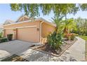 Well-maintained exterior of a single-Gathering home with a two-car garage and lush landscaping at 7317 Emma Rd, Bradenton, FL 34209