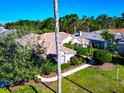 Beautiful single-Gathering home with lush greenery, a manicured lawn, and a peaceful, inviting atmosphere at 8224 Waterview Blvd, Lakewood Ranch, FL 34202