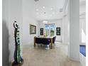 Elegant dining room with natural light, stylish decor, and seating for eight at 1909 Field Rd, Sarasota, FL 34231