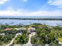Expansive waterfront property with lush greenery and unobstructed views of the bay at 1930 Bayshore Dr, Englewood, FL 34223