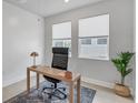 Bright home office featuring natural light, neutral decor, and modern furnishings at 2538 Fireflag Ln, Sarasota, FL 34232