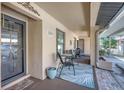 Charming porch with seating and decor outside the front door, creating an inviting entrance at 2808 60Th W Ave # 1603, Bradenton, FL 34207