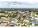 Suburban home with a school in the background, showing the location's proximity to community resources at 392 Yeager St, Port Charlotte, FL 33954