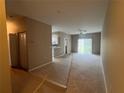 A spacious living room boasts neutral tones and sliding doors to the lanai at 3958 Mediterranea Cir # 411, Sarasota, FL 34233