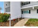 Charming condo exterior with a manicured garden area, a ramp, and neutral paint at 4753 Independence Dr, Bradenton, FL 34210