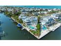 Waterfront home featuring a pool, boat dock, and rooftop deck offering stunning coastal community views at 511 Loquat Dr, Anna Maria, FL 34216