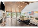 Expansive living room features vaulted wood ceilings, fireplace, and an abundance of natural light at 520 Harbor Cay Dr, Longboat Key, FL 34228