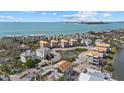 Picturesque aerial view featuring a pond and houses in different phases of construction by the ocean at 6924 Bochi Cir, Sarasota, FL 34242
