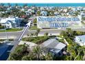 Aerial view showcasing the property's close proximity to the beach at 7701 Palm Dr, Holmes Beach, FL 34217