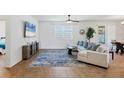 Spacious living room with tile flooring, a large window, and a comfortable sofa at 115 64Th E Ave, Bradenton, FL 34203