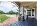 Charming front porch with stone accents and brick walkway, offering a welcoming entrance to the home at 1355 Debrecen Rd, Sarasota, FL 34240