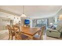 Open-concept living and dining area, featuring tile floors and ample seating space at 1711 Southwood St # 1711, Sarasota, FL 34231