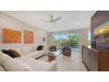 An open living space with modern decor, ample light, beautiful furniture and a clear view of the outdoors at 1800 Benjamin Franklin Dr # B208, Sarasota, FL 34236